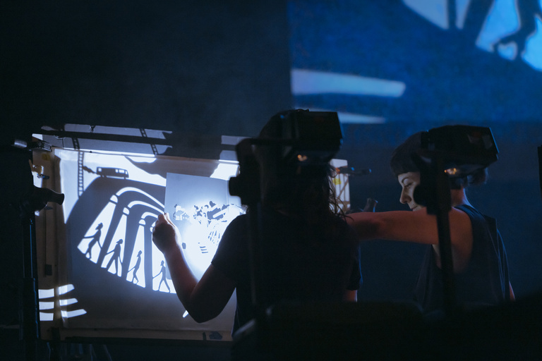 Manual Cinema performing live with Iron & Wine